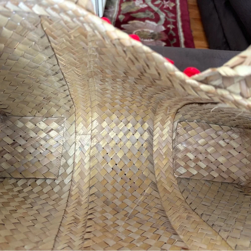 Handwoven Natural Straw Tote with Red Pom-Pom Trim - Picture 4 of 6